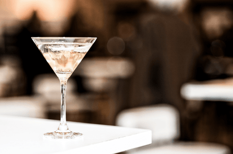 Martini on a table at a restaurant with a blurred background