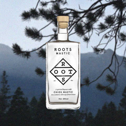 Roots mastic mastiha liqueur on backdrop of pine needles & sky