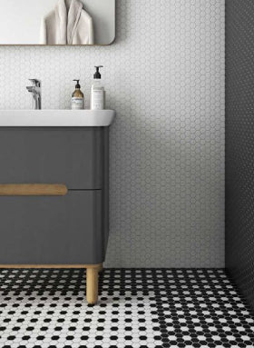 Miniworx black and white hexagonal mosaic tiles on bathroom floor and wall