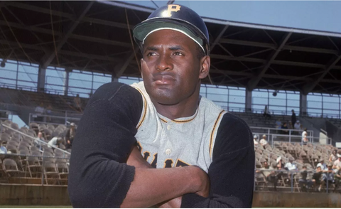Pittsburgh Pirate outfielder Roberto Clemente onlooking the baseball field