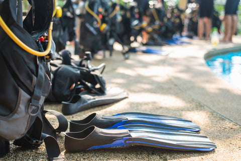 scuba diving fins on the side of a pool