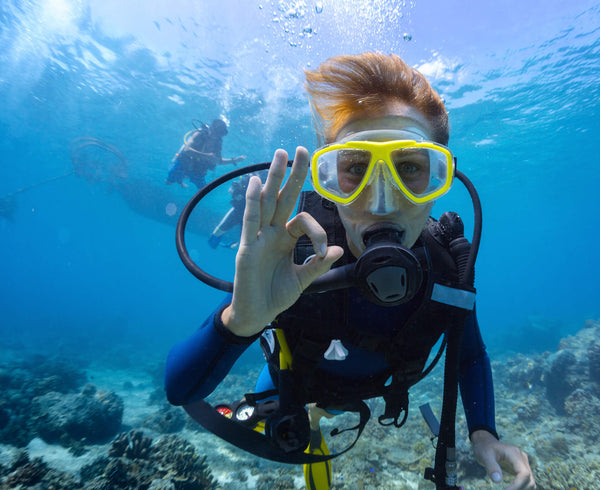 close up of scuba diving giving ok sign