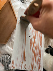 Adding texture using a stiff bristle paint brush