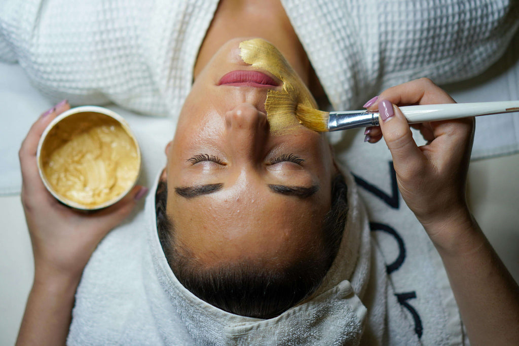 woman getting facial from spa