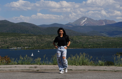 Stephanie Ayala McHugh in front of a lake and mountains