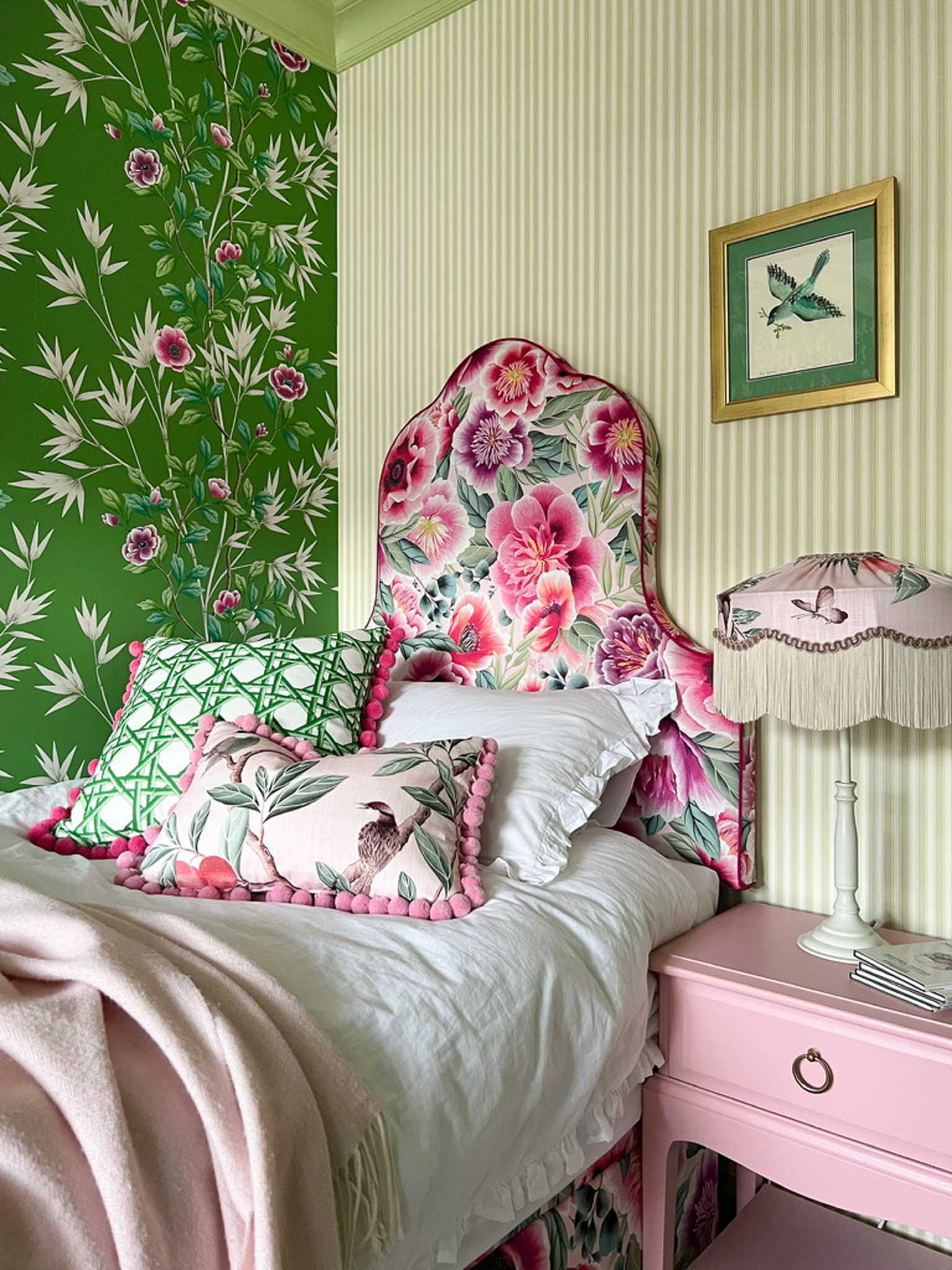 Pink and green maximalist bedroom with green chinoiserie wallpaper and pink floral headboard