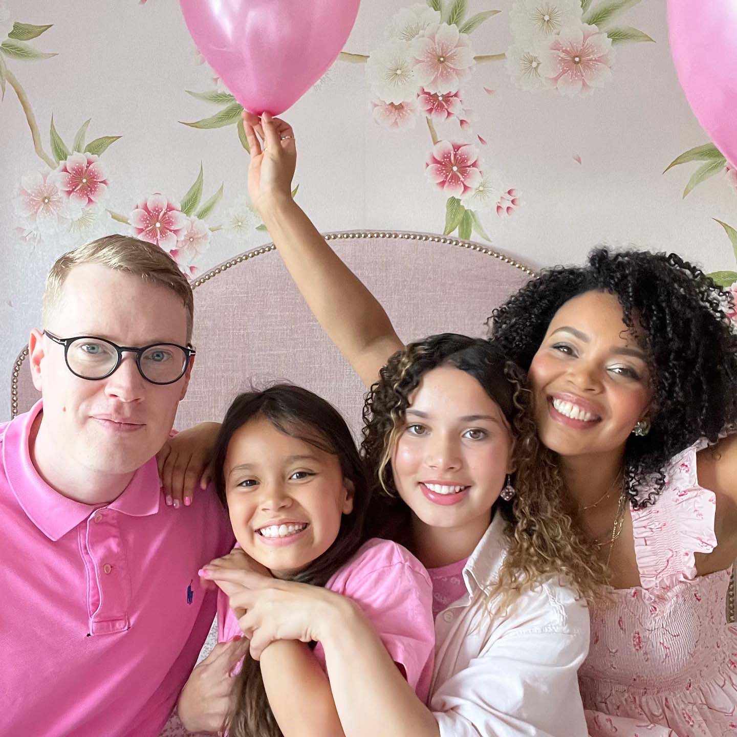 diane hill and family in front of chinoiserie blossom flower wallpaper mural