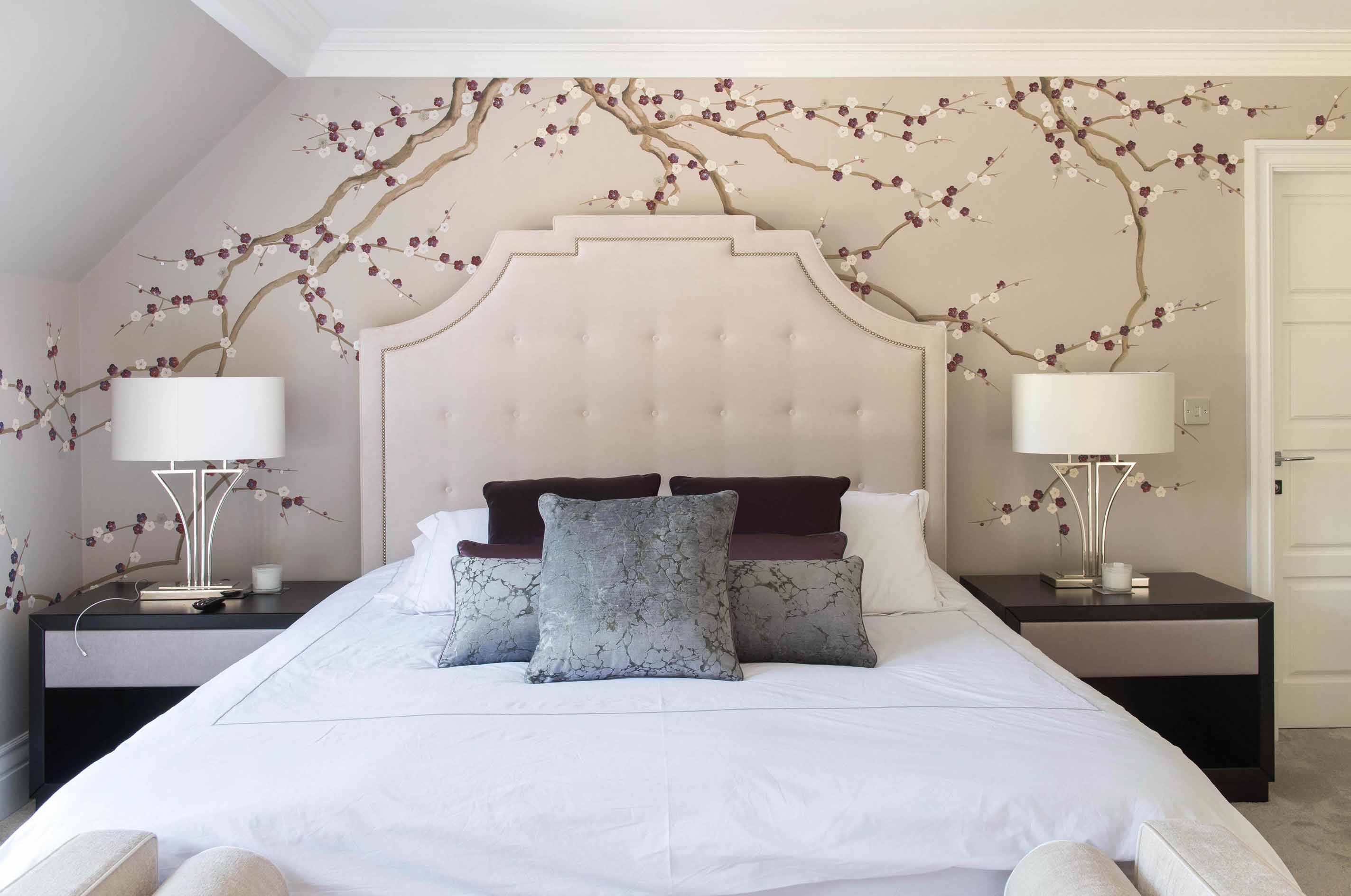 Hand-painted chinoiserie blossom flower mural by diane hill in a bedroom