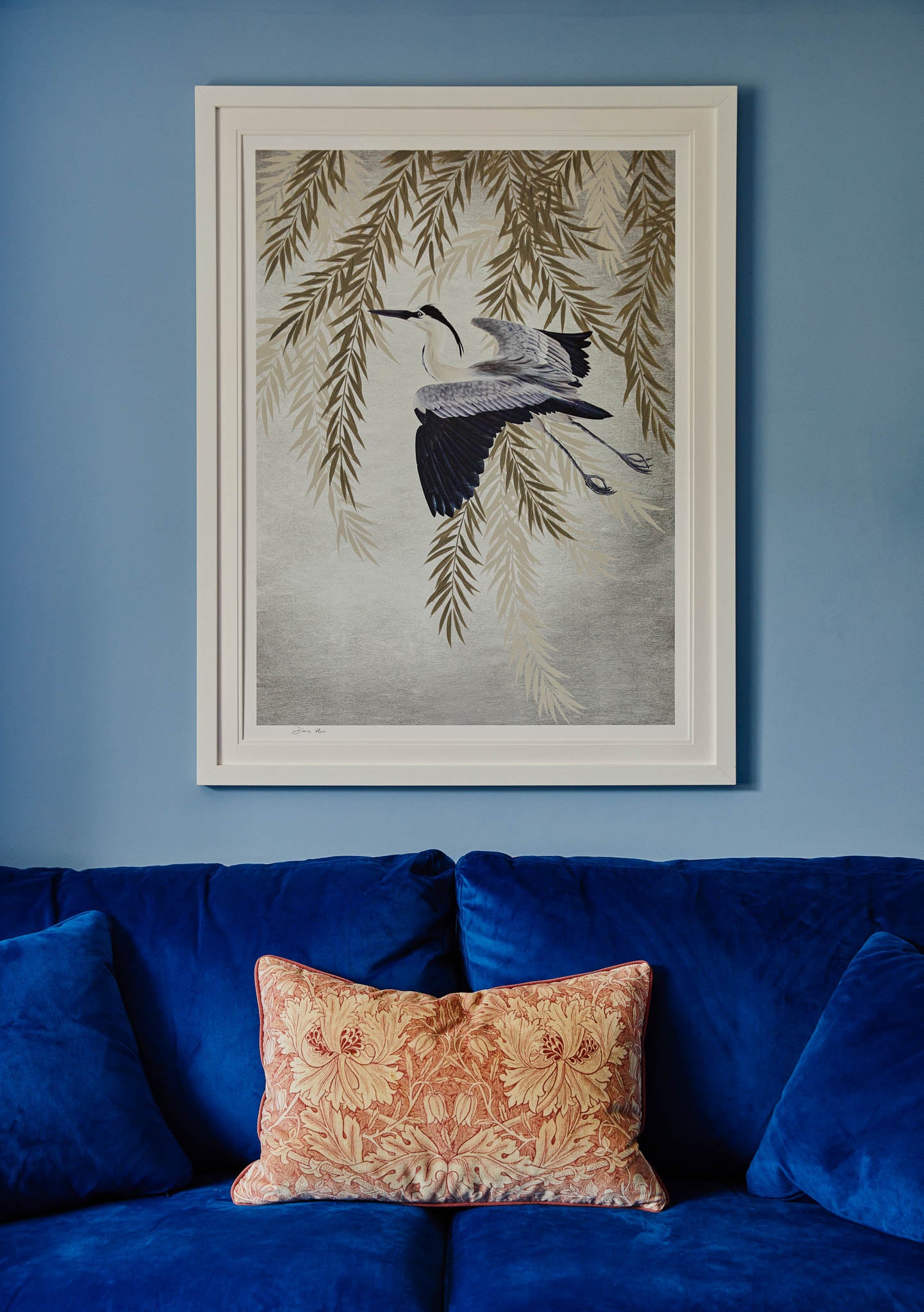 silver botanical bird chinoiserie art print in luxurious blue modern living room