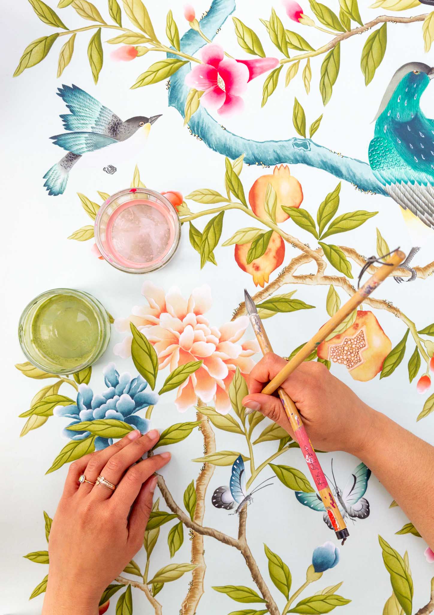 Diane Hill using chinoiserie paintbrushes to paint the original design for her 'Felicity' wall art print