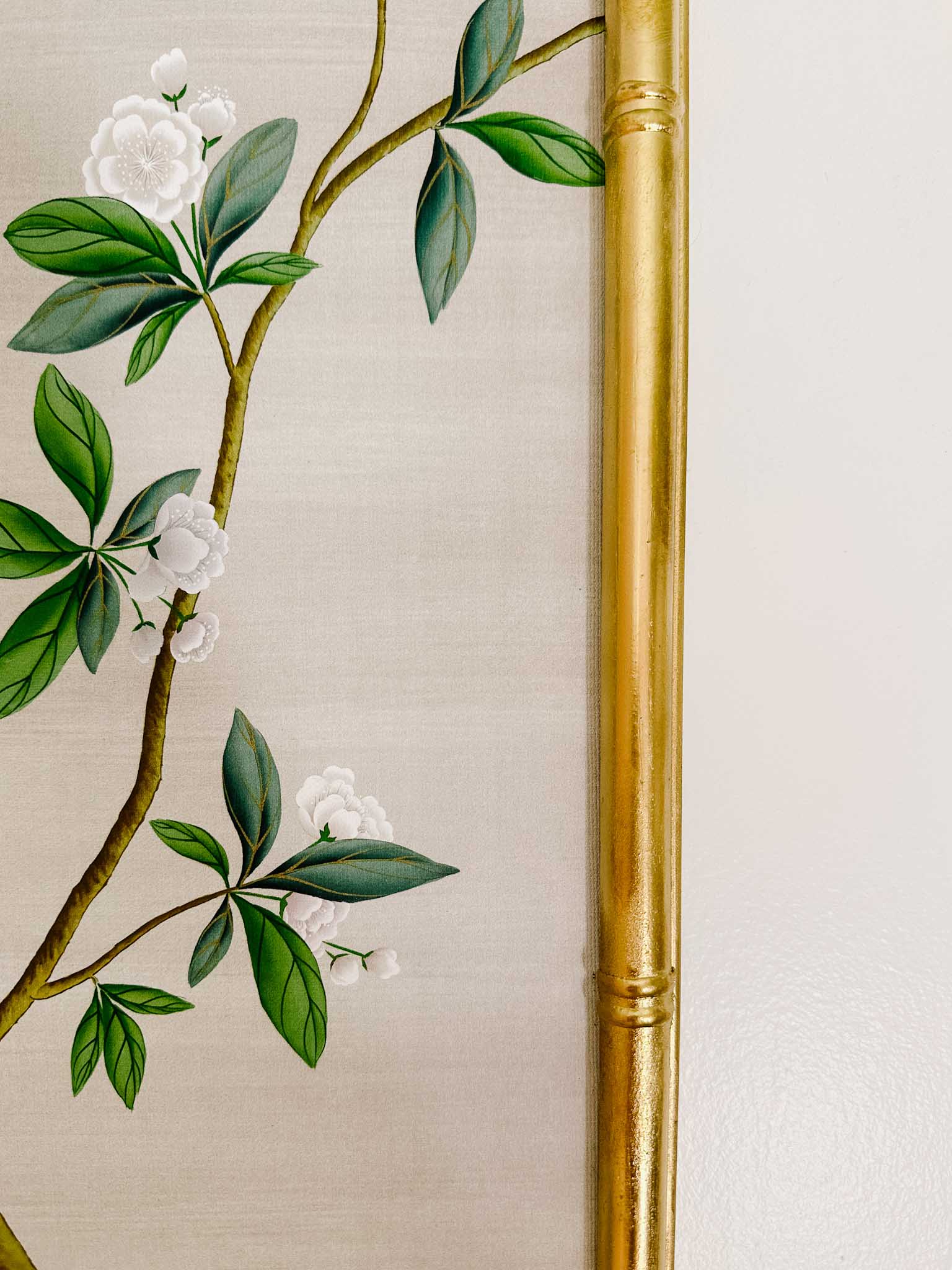 Up close photo of the gold bamboo framed blogger 'At Home With Ashley' created for her 'Pearly Gates chinoiserie panel by Diane Hill