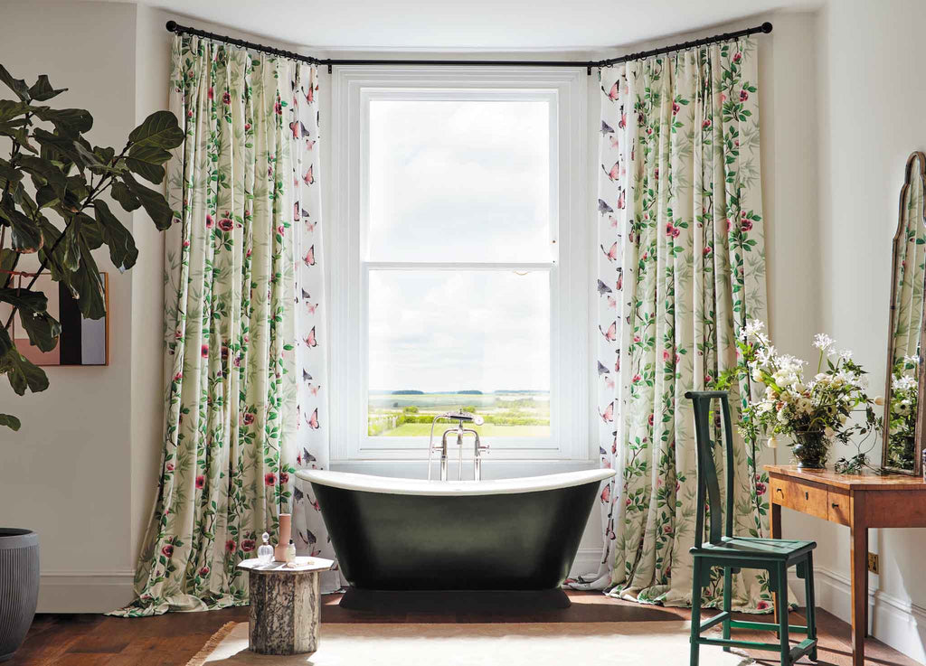 Lady Alford Chinoiserie floral fabric hanging as curtains in a beautiful bathroom