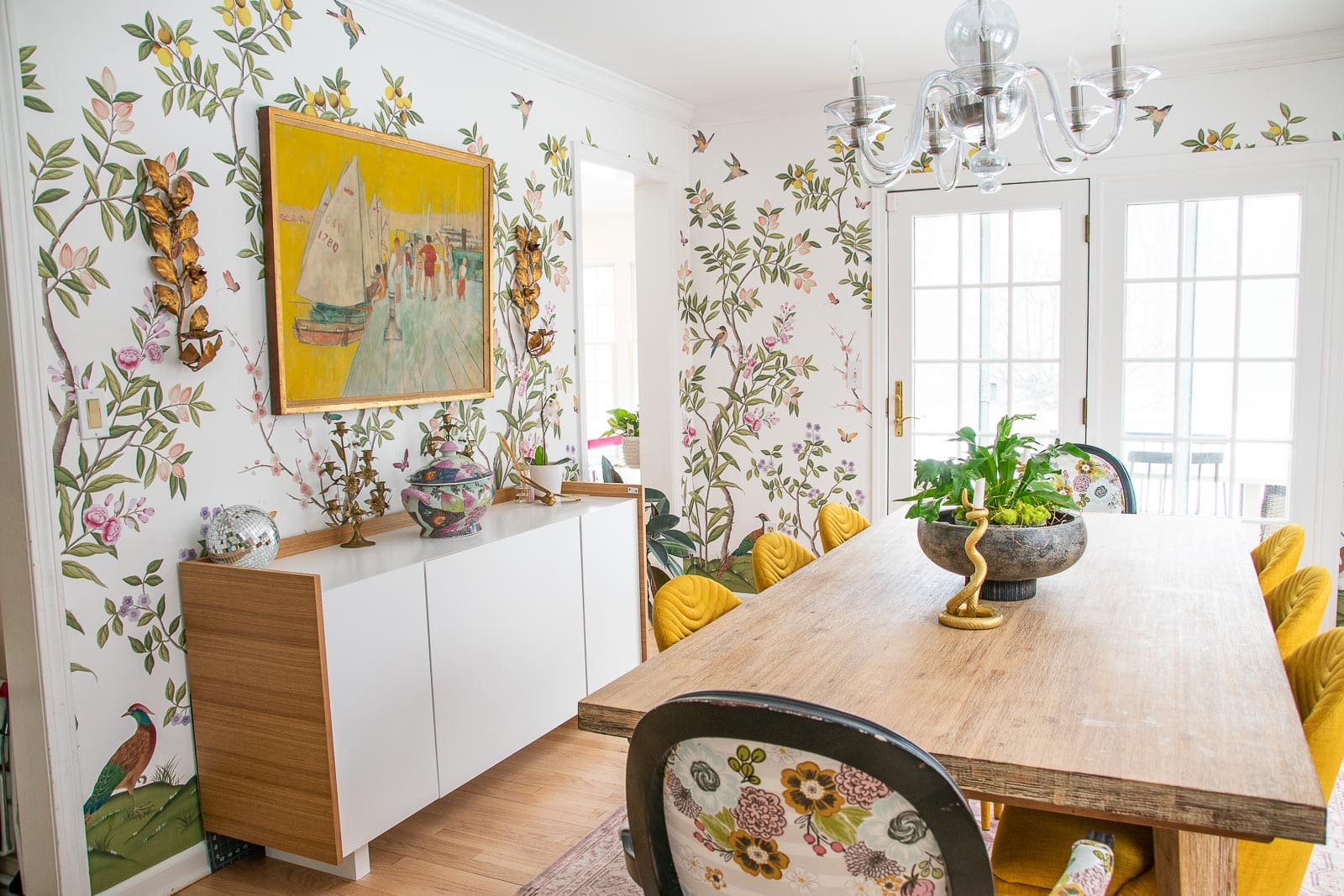Maximalist style dining room featuring Diane Hill's chinoiserie wallpaper design for Rebel Walls