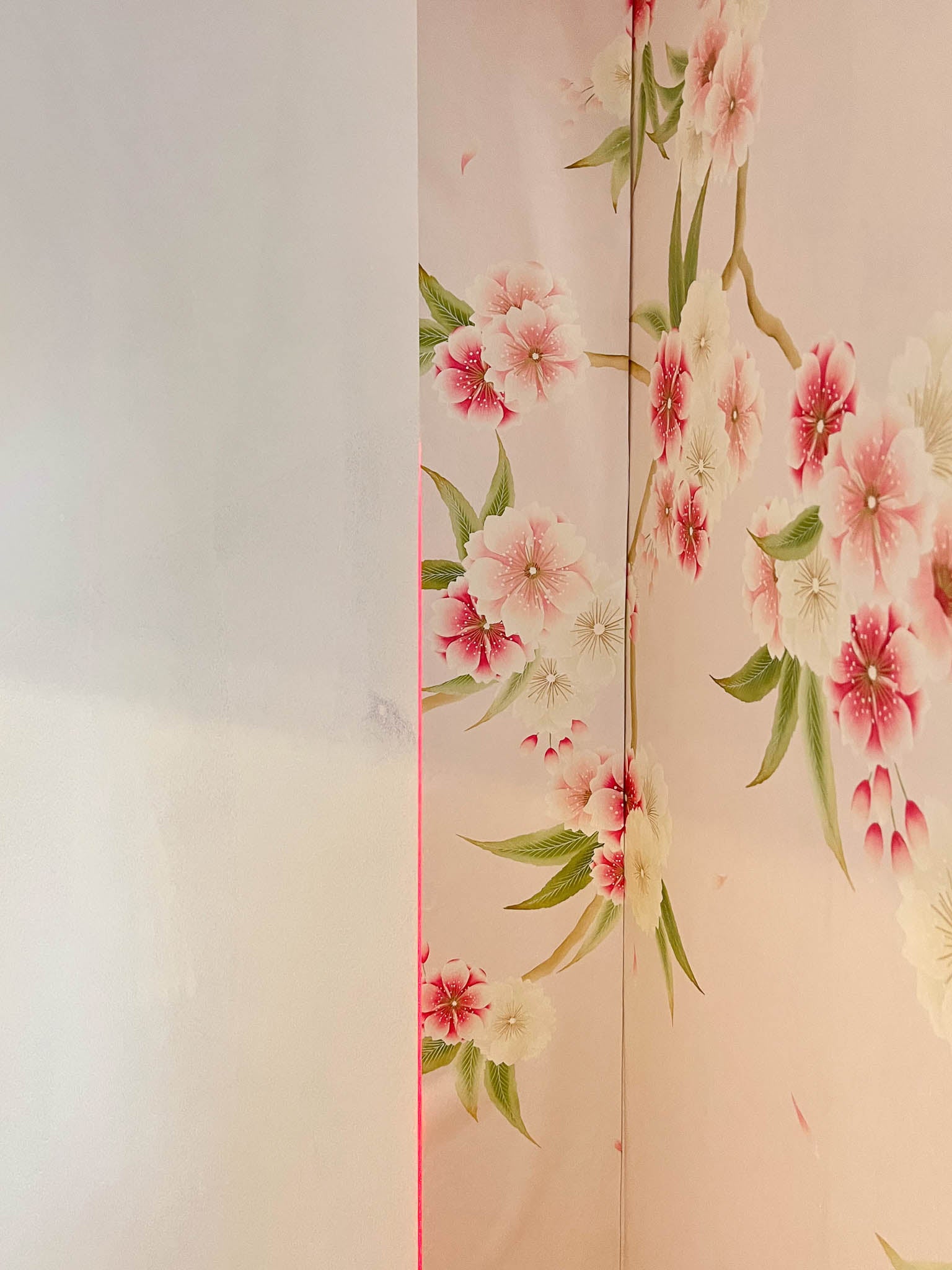 Diane Hill's 'Rosa' wallpaper mural section in line with a straight laser edge