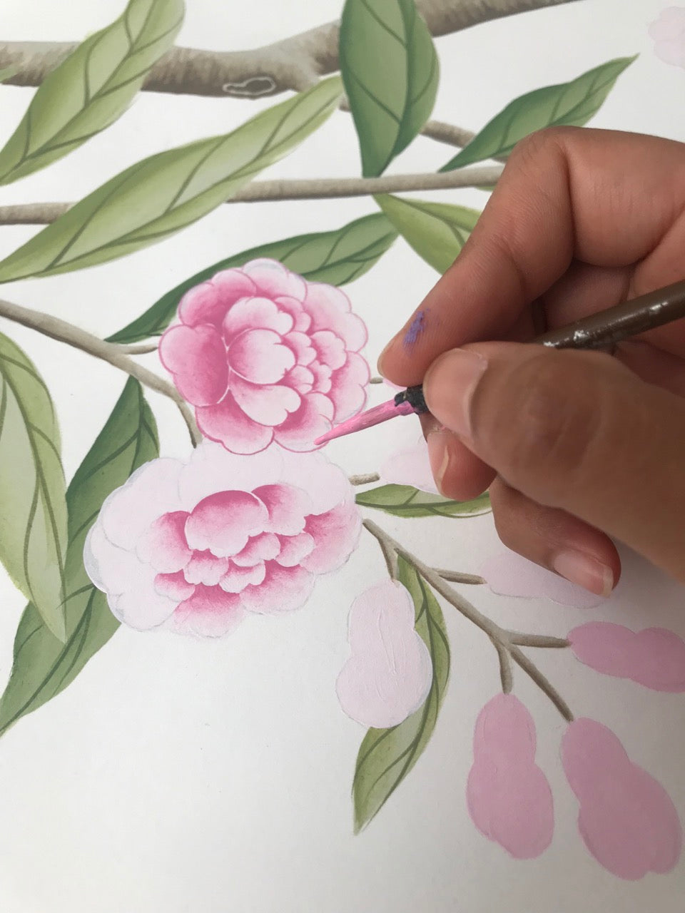 Up close photo of a flower being painted by Diane Hill's using chinoiserie painting techniques