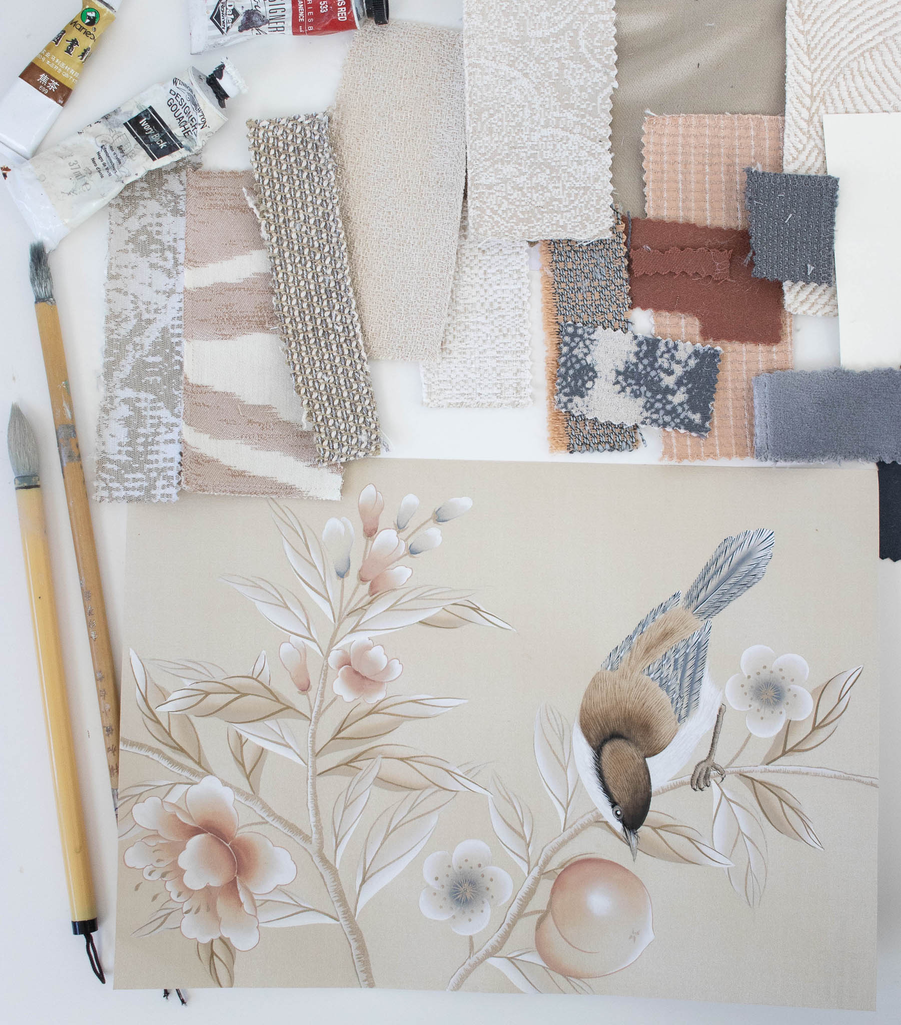 botanical bird chinoiserie design with Chinese paintbrushes and home decor fabric swatches to create visual mood board