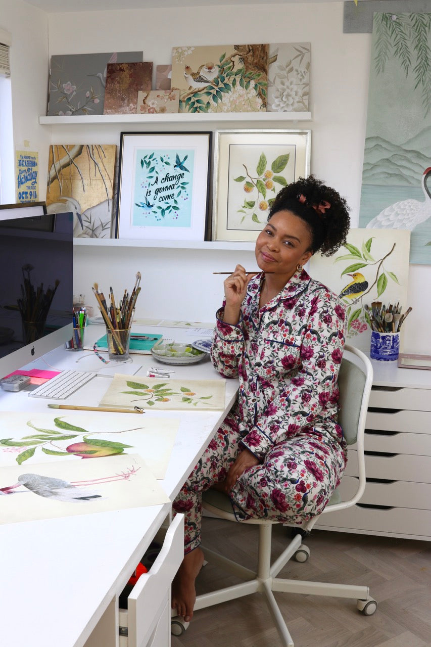 Diane Hill in her art studio with chinoiserie and botanical wall art prints