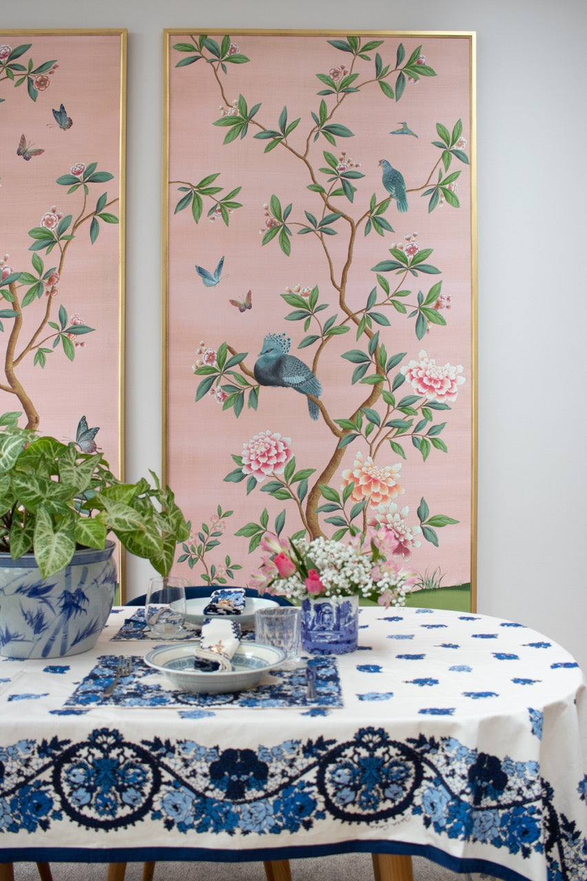 Dining table with blue and white chinoiserie tableware in front of Diane Hill's 'Florence' framed wallpaper panels