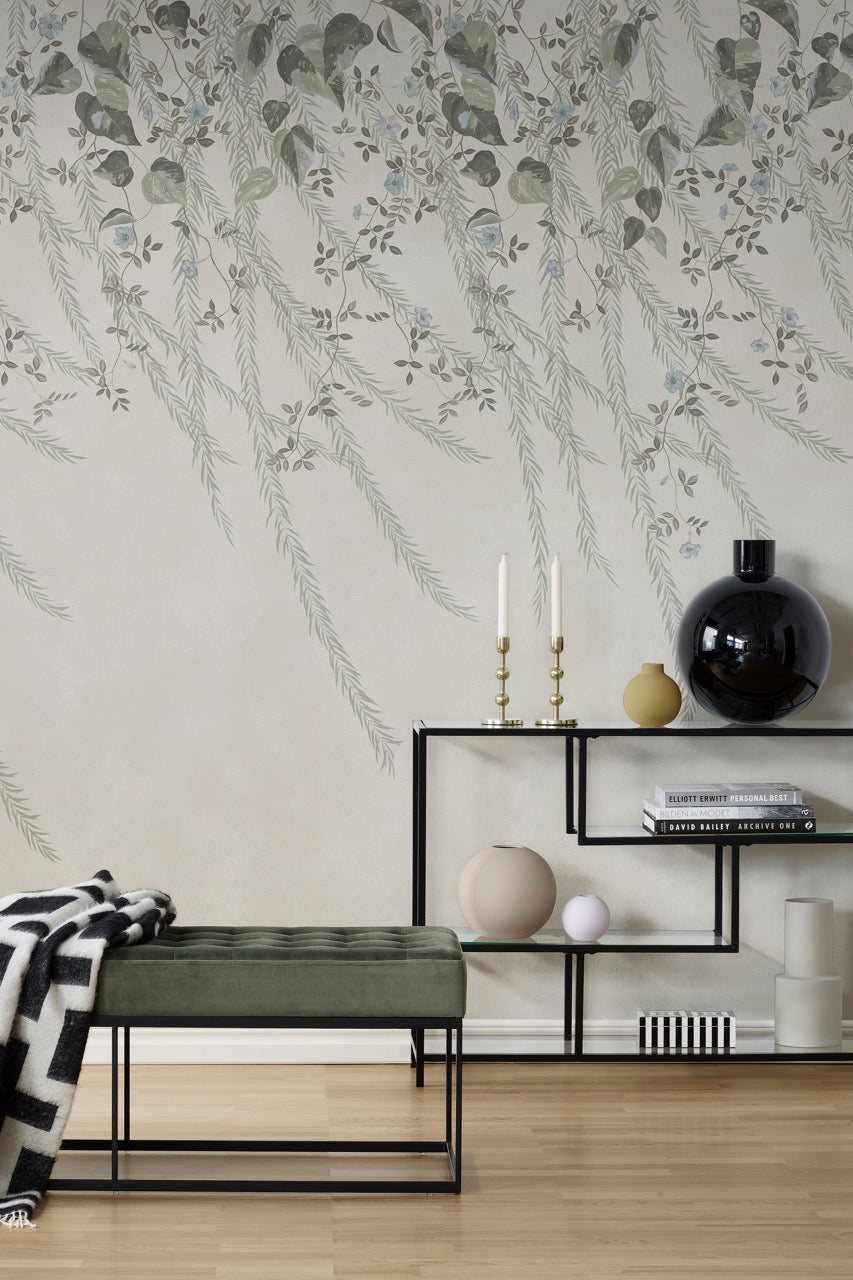 Lifestyle photo of Diane Hill's 'Lush Foliage, Sage Tint' chinoiserie wallpaper for Rebel Walls