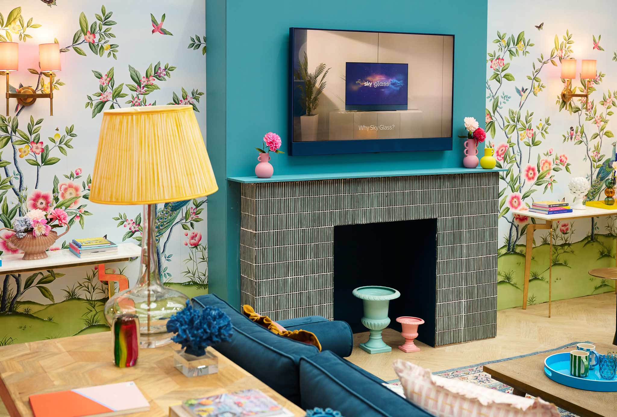 Floral wallpaper mural with sky glass TV beautiful maximalist colourful living room