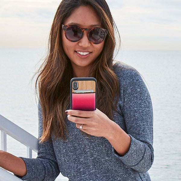 image of a woman holding a phone