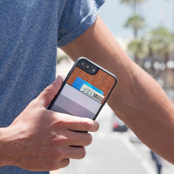 image of a man holding an iPhone