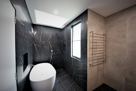 Striking black tiles in Redfern bathroom