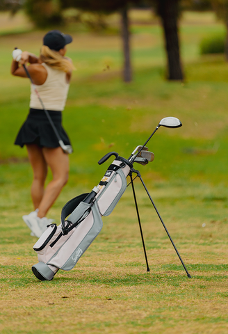 woman golfing with a Sunday Golf Loma bag