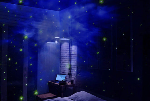 Astronaut galaxy projector playing in a bedroom, at night.