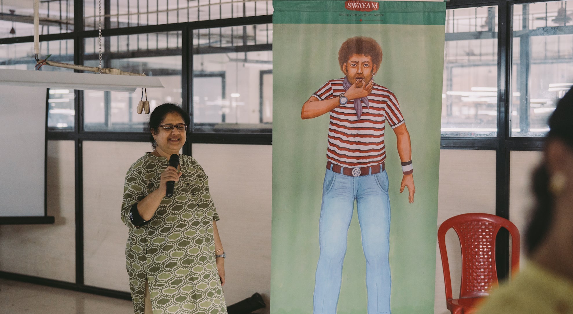 Woman giving an equal opportunities training to employees at our factory