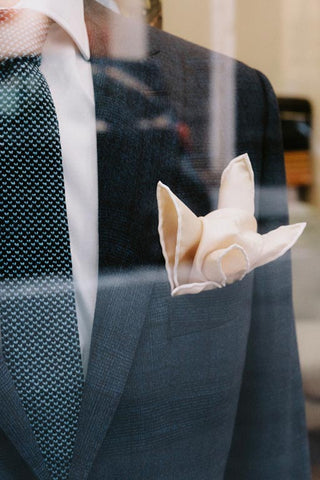 man in suit with pocket square