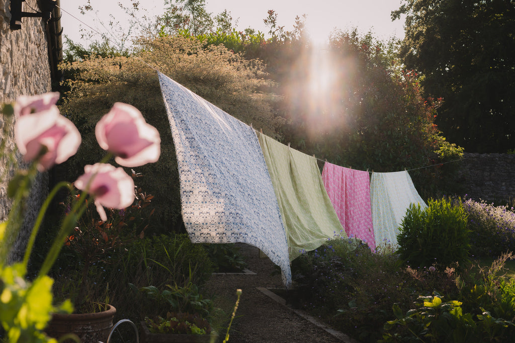 10 year anniversary collection Coco & Wolf bedding hanging on washing line