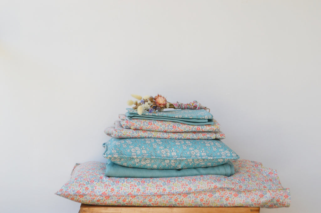 Stack of Liberty fabric products by Coco & Wolf