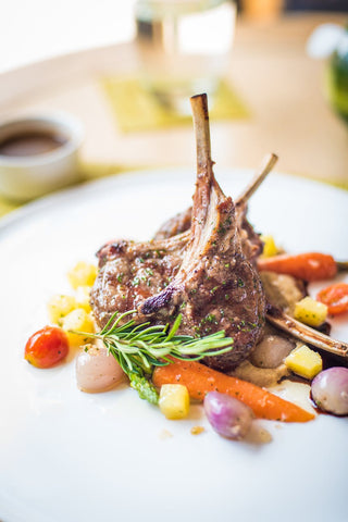 Plate with cooked steak and vegetables