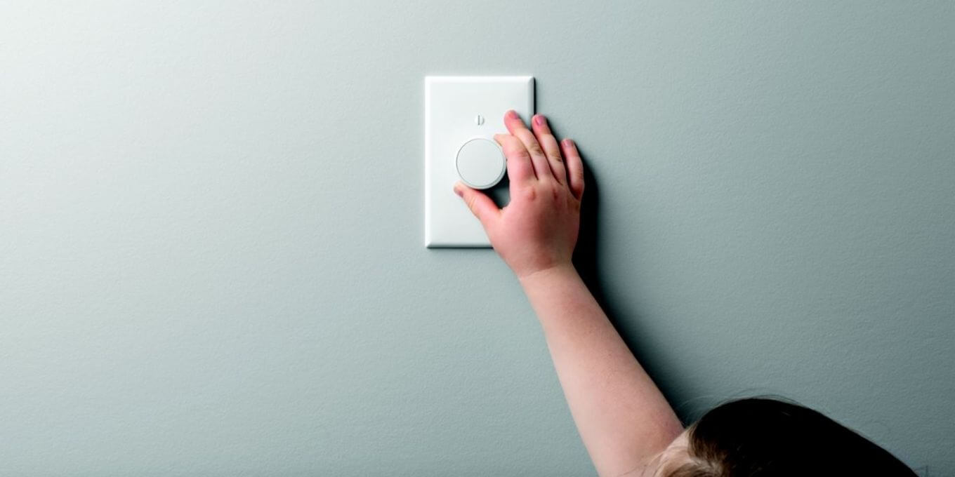 Small child turning off light switch