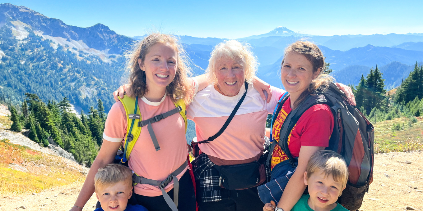 Sierra Roundy with her mother and children with a mountain in the background