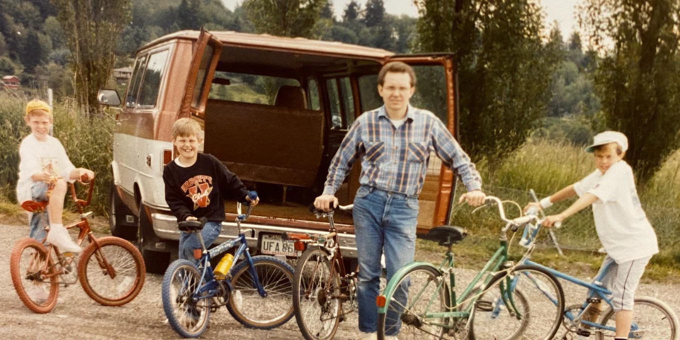 Steve Rode and his boys with bicycles in front of an old 70's van