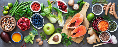 Table full of healthy fruits and vegetables.