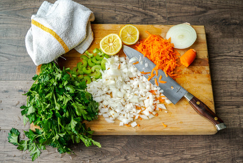 Town Cutler Classic stainless steel knife with herbs and vegetables on cutting board