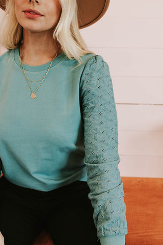 light weight teal sweater with detailed sleeves. www.loveoliveco.com