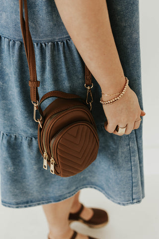 brown small crossbody bag to hold your essentials. www.loveoliveco.com