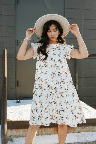 ivory floral dress to wear to spring graduation. www.loveoliveco.com