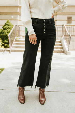 trending black denim with a high waistline and a raw hem at the ankles. www.loveoliveco.com