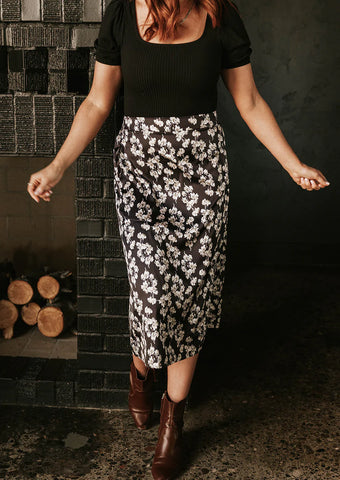 silky black skirt with a white floral pattern. www.loveoliveco.com