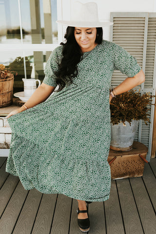 flowy green dress with daisy floral pattern. www.loveoliveco.com