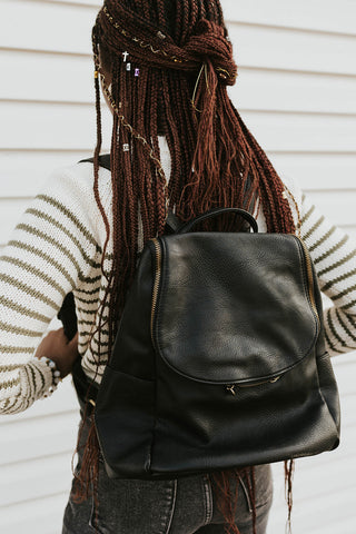 pleather black backpack with plenty of storage and pockets to keep things organized. www.loveoliveco.com