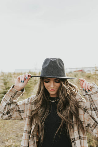 wide-brimmed hat made out of a charcoal felt material. www.loveoliveco.com