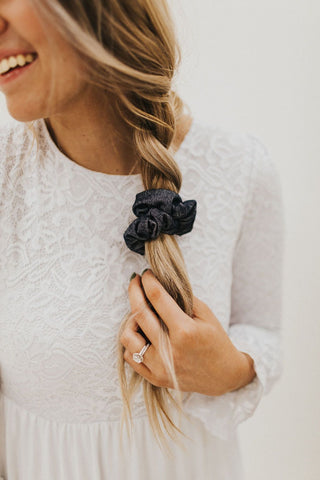 how to finish off your loose french braid with a hair scrunchie. www.loveoliveco.com