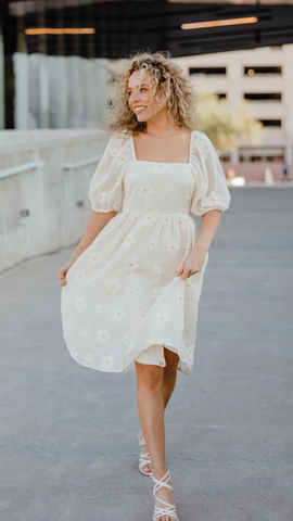 cream dress with embroidered flower details. www.loveoliveco.com