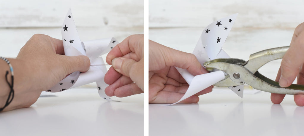 Using a hole punch to score a small hole in the center of the folded pinwheel.